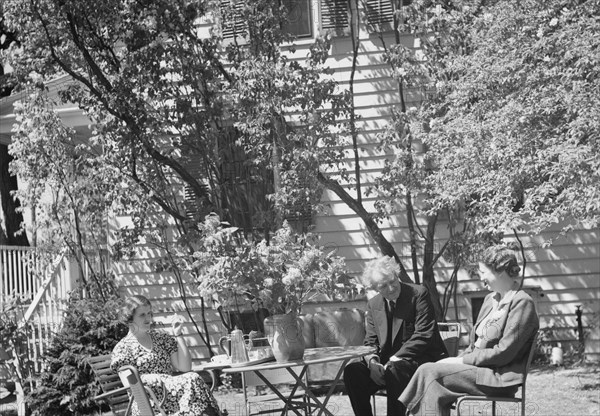 Benson, Mary, Mrs., with Arnold Genthe and an unidentified woman seated ouside at..., c1933-c1942. Creator: Arnold Genthe.