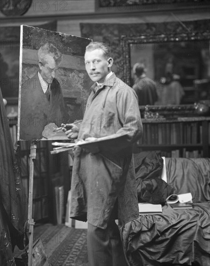 J.M. Williamson painting a portrait of Arnold Genthe, 1915. Creator: Arnold Genthe.