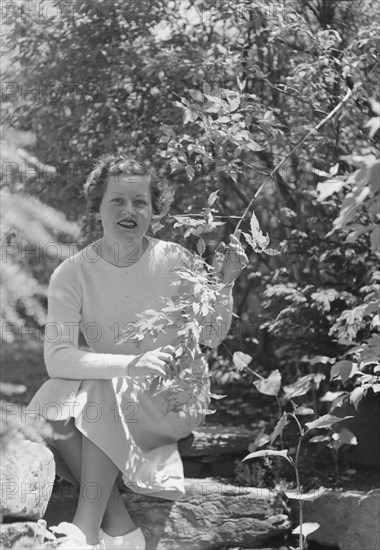 Mrs. Mary Benson seated outdoors, between 1933 and 1942. Creator: Arnold Genthe.