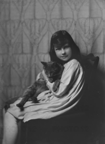 Daughter of Mrs. H Gamble, with cat, portrait photograph, 1917 Nov. 23. Creator: Arnold Genthe.