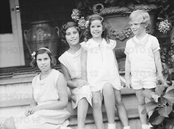 Children of W.G. Kimball, seated on the steps of their house, between 1911 and 1942. Creator: Arnold Genthe.