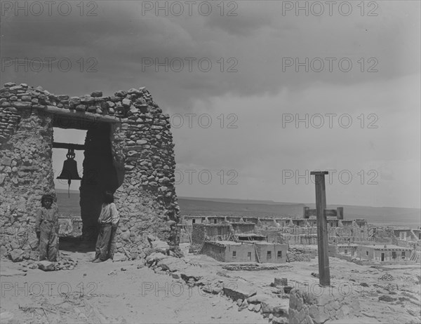 North American Indian children on roof of San Estevan Mission, Acoma Pueblo, New Mexico, c1899-c1928 Creator: Arnold Genthe.