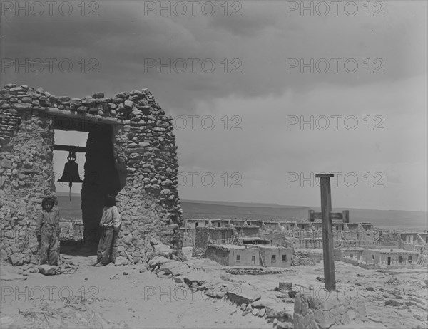 North American Indian children on roof of San Estevan Mission, Acoma Pueblo, New Mexico, c1899-c1928 Creator: Arnold Genthe.