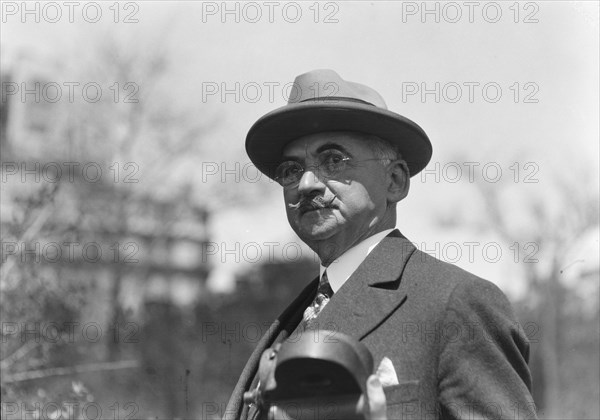 Dr. Maximilian Toch, standing outdoors, 1936. Creator: Arnold Genthe.