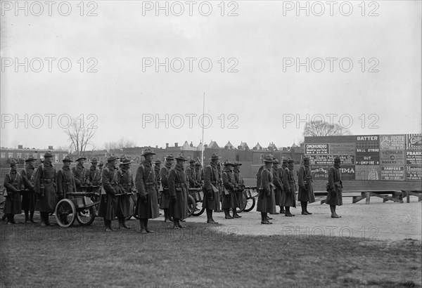 Marine Corps, U.S.N. Machine Gun Unit Demonstration at Ball Park, 1917. Creator: Harris & Ewing.