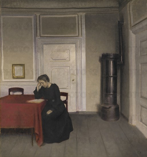 A Room in the Artist's Home in Strandgade, Copenhagen, with the Artist's Wife, 1902. Creator: Vilhelm Hammershøi.