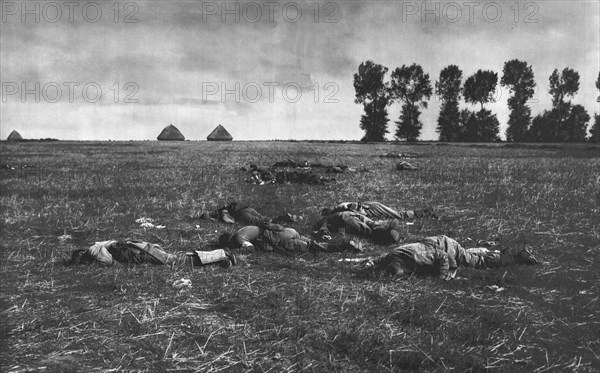 ''Le Reve Ecroule; Des cadavres Allemands dans la plaine', 1914. Creator: J Simont.