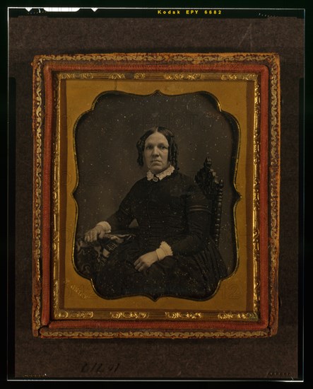 Unidentified woman, three-quarters length portrait, seated in chair with right arm..., ca. 1855. Creator: Francis Grice.