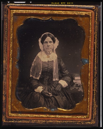 Unidentified woman, three-quarters length portrait, seated with left arm resting..., ca. 1855. Creator: Francis Grice.