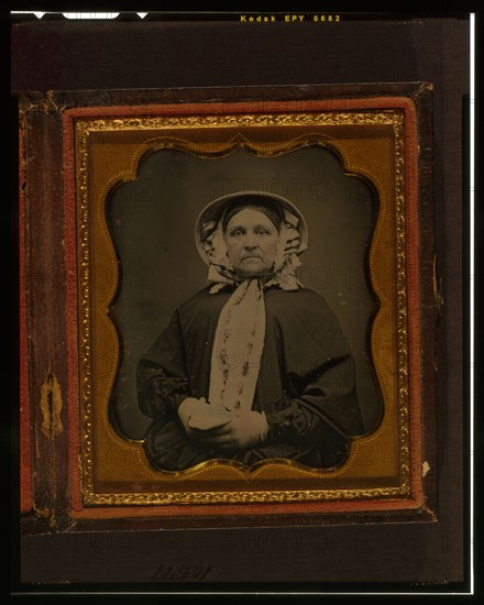 Unidentified woman, half-length portrait, wearing gloves, between 1840 and 1860. Creator: Unknown.