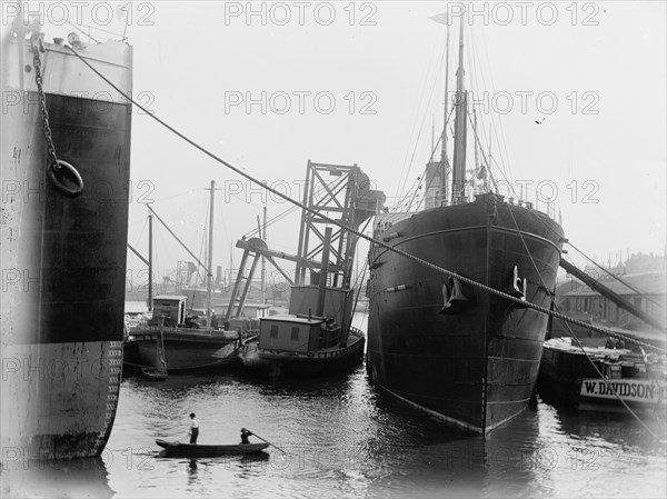 Loading steamers in Montreal harbor, between 1880 and 1901. Creator: Unknown.