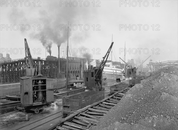 Whirleys unloading ore, Penna. R.R. [Pennsylvania Railroad] docks, Erie, Pa., ca 1900. Creator: William H. Jackson.