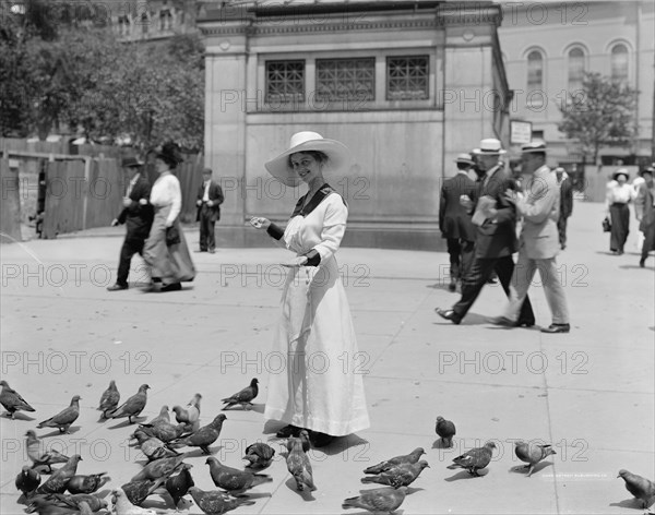 Feeding the pigeons, Boston Common, possibly 1911 or 1912. Creator: William H. Jackson.