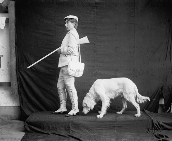 Billy and his mistress in hunting poses, between 1895 and 1910. Creator: Unknown.