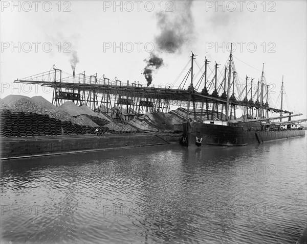 Unloading ore at L.S. & M.S. [Lake Shore & Michigan Southern] Ry. Co.'s docks, Ashtabula, Ohio,c1900 Creator: Unknown.