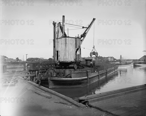 Fueling lighter with clam shell hoist, Ashtabula, Ohio, ca 1900. Creator: Unknown.