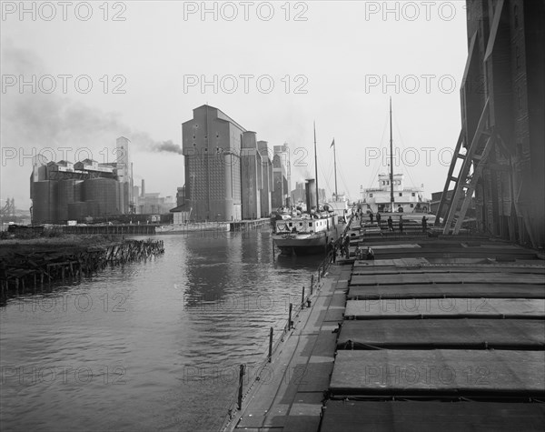 Unloading wheat, Buffalo, N.Y., c.between 1910 and 1920. Creator: Unknown.