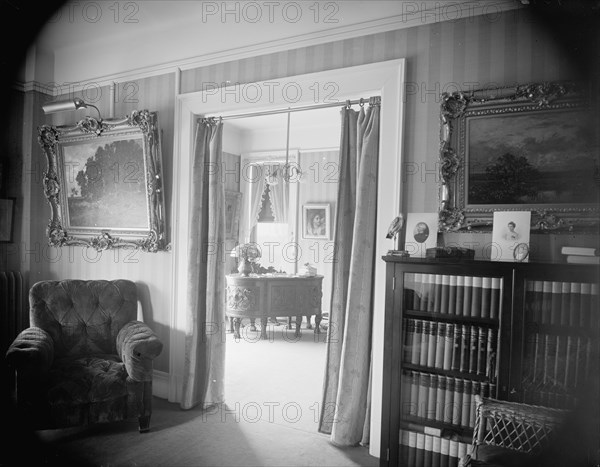 Room with bookcase, study with desk, between 1900 and 1915. Creator: Unknown.