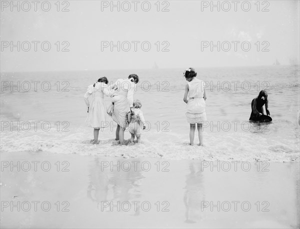 Baby's first lesson, between 1900 and 1905. Creator: Unknown.