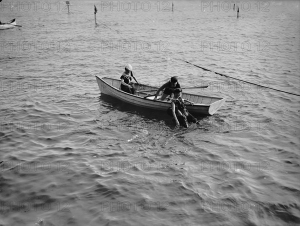 Saving a life, between 1900 and 1905. Creator: Unknown.