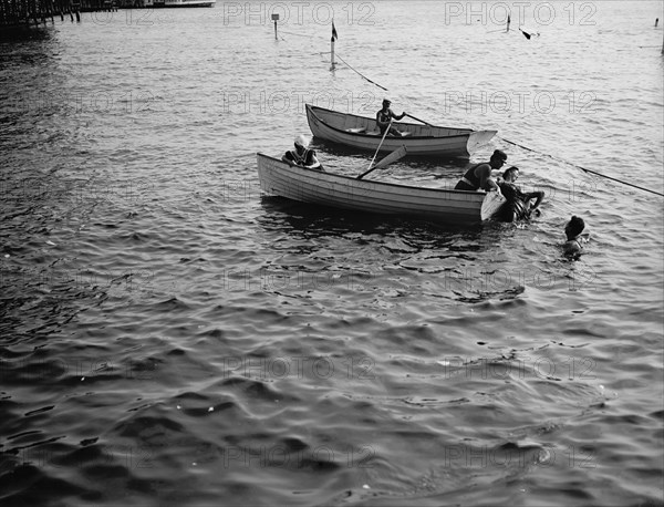 Saving a life, between 1900 and 1905. Creator: Unknown.