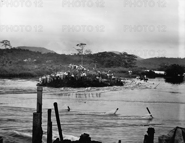 First rush of water through Gamboa dyke, Panama Canal, c.between 1910 and 1914. Creator: Unknown.