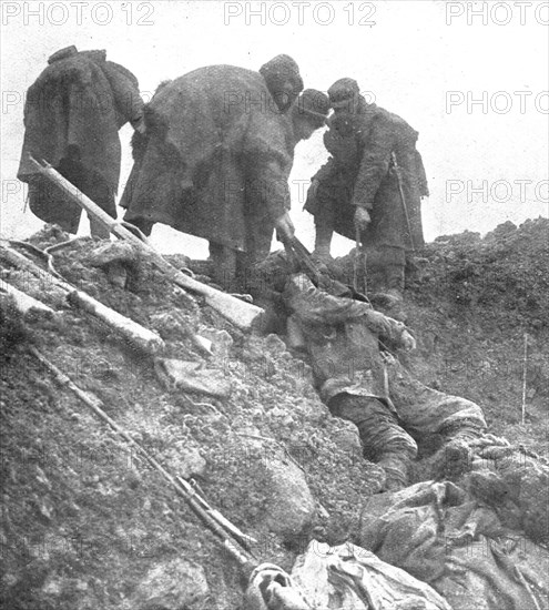 'Dans les Hauts-de-Meuse; nos hommes retirent, les cadavres allemands', 1915. Creator: Unknown.