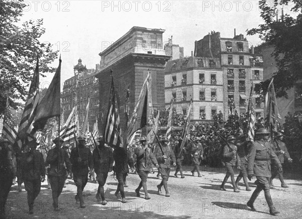 'Le jour de gloire; au coeur de Paris: le defile sur les grands boulevards jusqu'a la place..., 1919 Creator: Unknown.