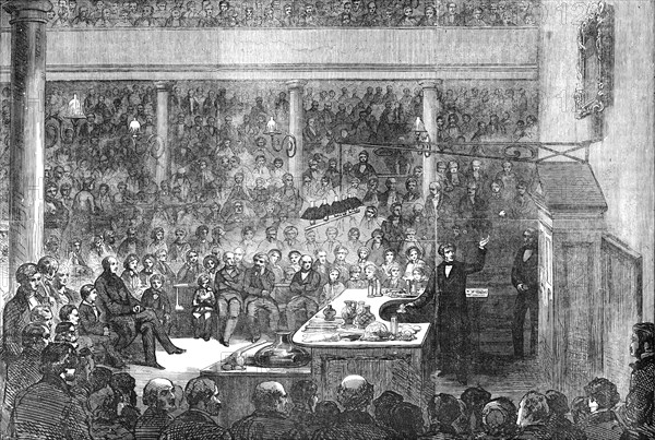 Professor Faraday lecturing at the Royal Institution, before H.R.H. Prince Albert, the Prince of Wal Creator: Unknown.