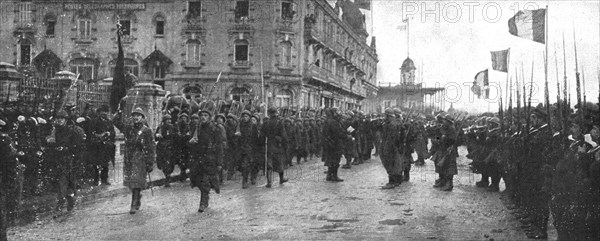 'Le deuxieme anniversaire de L'Yser; le defile du 12e de ligne belge, son glorieux..., 1916. Creator: Unknown.