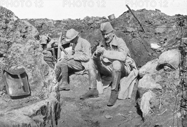 'Ceux de Bouchavesnes; le chef de bataillon de Pelacot, dans une tranchee, quelques..., 1916. Creator: Unknown.