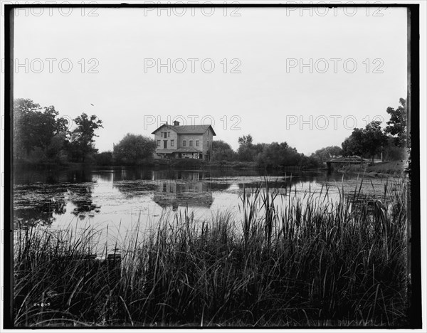 Green Lake, Wis., old mill at railway station, between 1880 and 1899. Creator: Unknown.