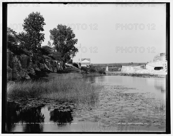 Racine, Wis., Root River rapids, old cement mills, between 1880 and 1899. Creator: Unknown.