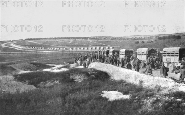 'Au Volant; Sur une route strategique, a proximite de la ligne de feu: releve de troupes par...,1918 Creator: Unknown.