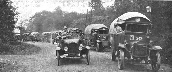 'Au Volant; convoi d'autos-camions menes par des conducteurs indo-chinois, sous..., 1918. Creator: Unknown.