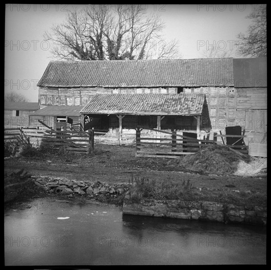 An unidentified timber framed barn with attached cart shed, Herefordshire, 1944. Creator: Marjory L Wight.