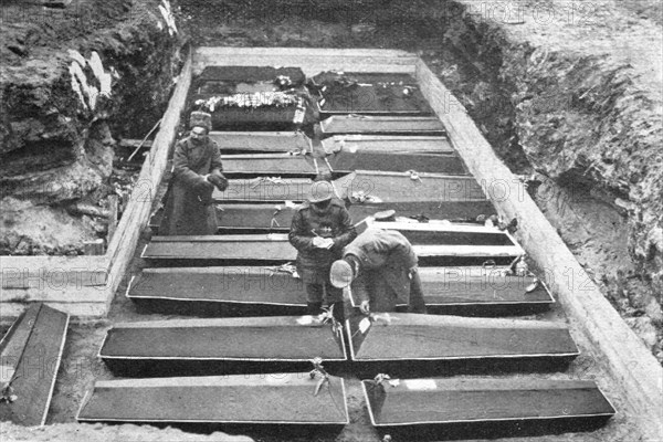 'Les Funerailles des Morts de la Revolution; Les cercueils ranges dans la fosse, au Champ..., 1917. Creator: Unknown.