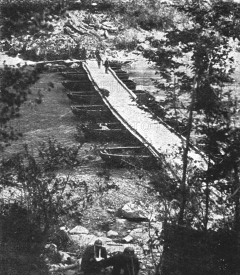 Italian Offensive of the Isonzo; Decking is laid over the boats, 1917. Creator: Unknown.