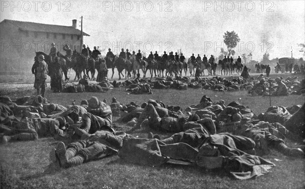 The Dark Hours of Italy; Detachment of infantry, exhausted, resting under protection... 1917. Creator: Unknown.