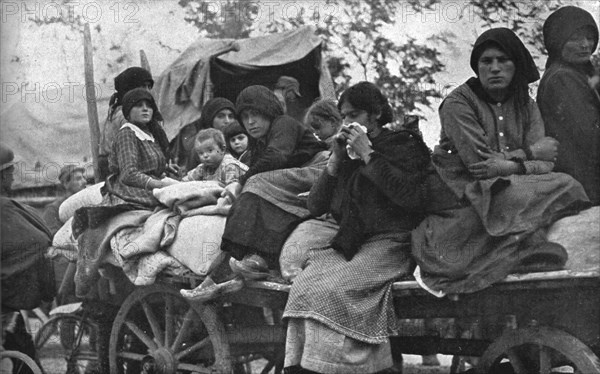 The Dark Hours of Italy; Women and children of Friuli and Carnia fleeing..., 1917. Creator: Unknown.