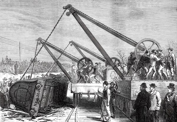 The Railway Accident at Abbotts Ripton, Huntingdon: raising an engine from the wrecked train, 1876. Creator: Unknown.