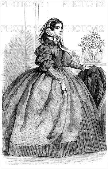 Fashions for November - Dress of Silver-Grey Silk, 1858. Creator: Unknown.