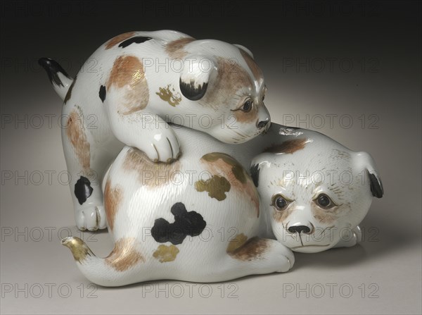 Okimono in the Form of a Pair of Gamboling Piebald Puppies, 19th century. Creator: Unknown.