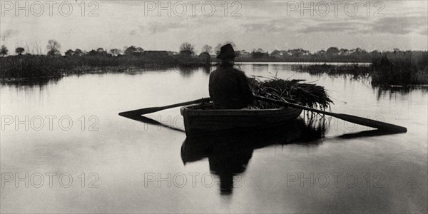 Rowing Home the Schoof-Stuff, 1886. Creator: Peter Henry Emerson.