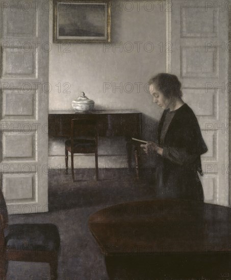 Interior with a Reading Lady, 1900. Creator: Vilhelm Hammershoi.