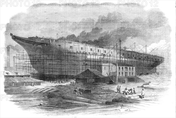 Building the great steam-frigate "Warrior" at the Thames Ironworks, Blackwall, 1860. Creator: Smyth.