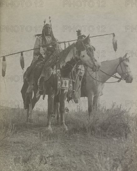 Village criers on horseback, Bird On the Ground and Forked Iron, Crow Indians, Montana, c1908. Creator: Edward Sheriff Curtis.