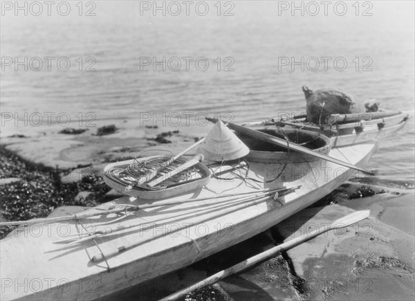 Kaiak with seal hunting equipment, Nunivak, c1929. Creator: Edward Sheriff Curtis.