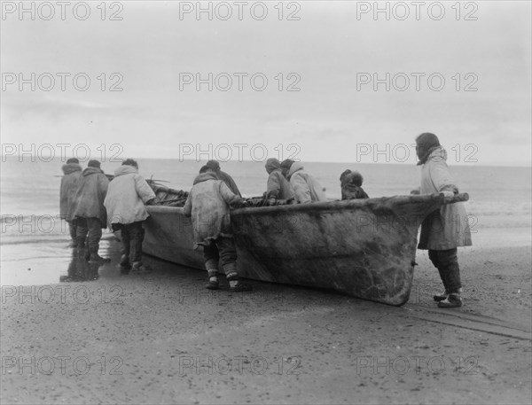 Launching the whale boat-Cape Prince of Wales, c1929. Creator: Edward Sheriff Curtis.