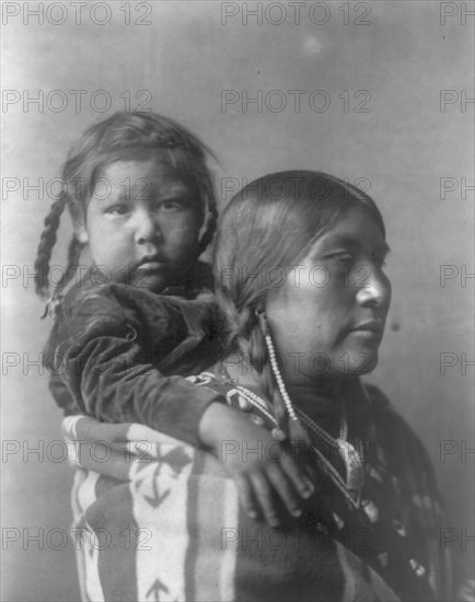 Apsaroke mother, c1908. Creator: Edward Sheriff Curtis.